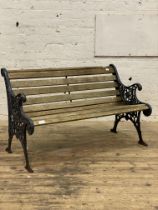 A cast metal and slatted teak three seat garden bench. L126cm.