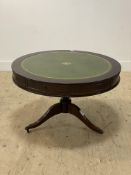 A Regency style mahogany drum table, the circular top inset with tooled green leather surface, above