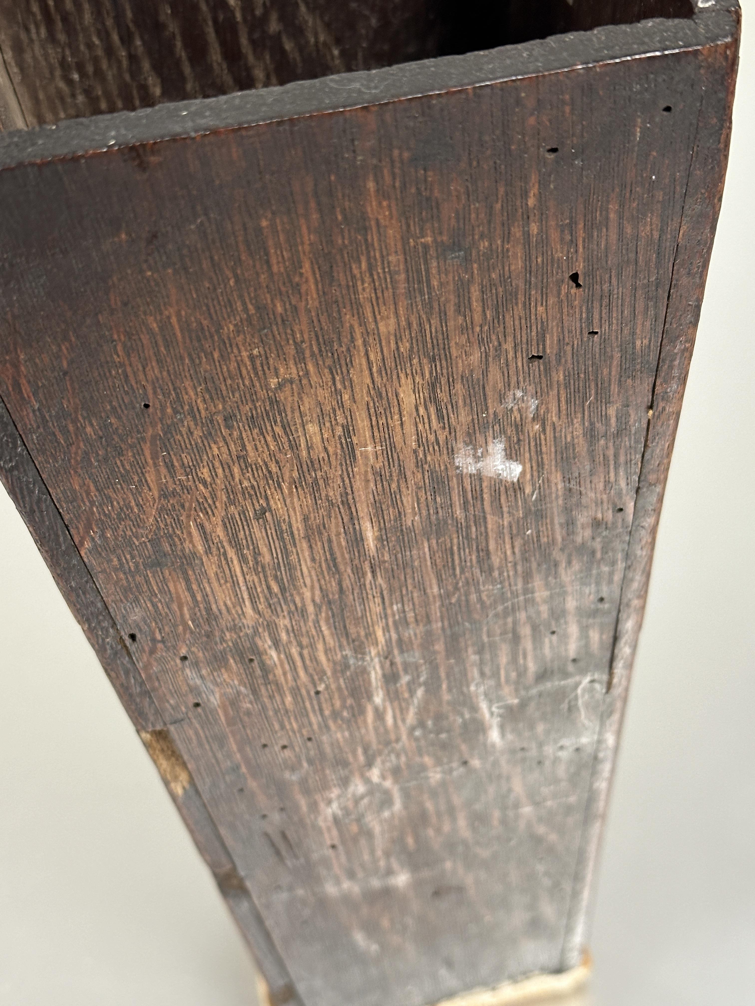 A 18thc oak candle box of tapered form with arched panel back with pierced hole and replaced base - Image 4 of 5