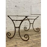 A 19th century French wrought iron patisserie table base of scrolling form, H73cm, D142cm, L72cm.