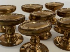 Four pairs of Victorian brass / copper door knobs, each handle of oval outline.