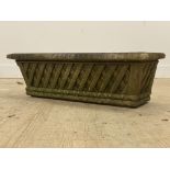 A reconstituted stone trough shaped planted with lattice design. L88cm, D31cm, H28cm