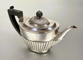 A late Victorian Edinburgh  silver oval half lobbed tea pot by  Mackay & Chisholm with stained