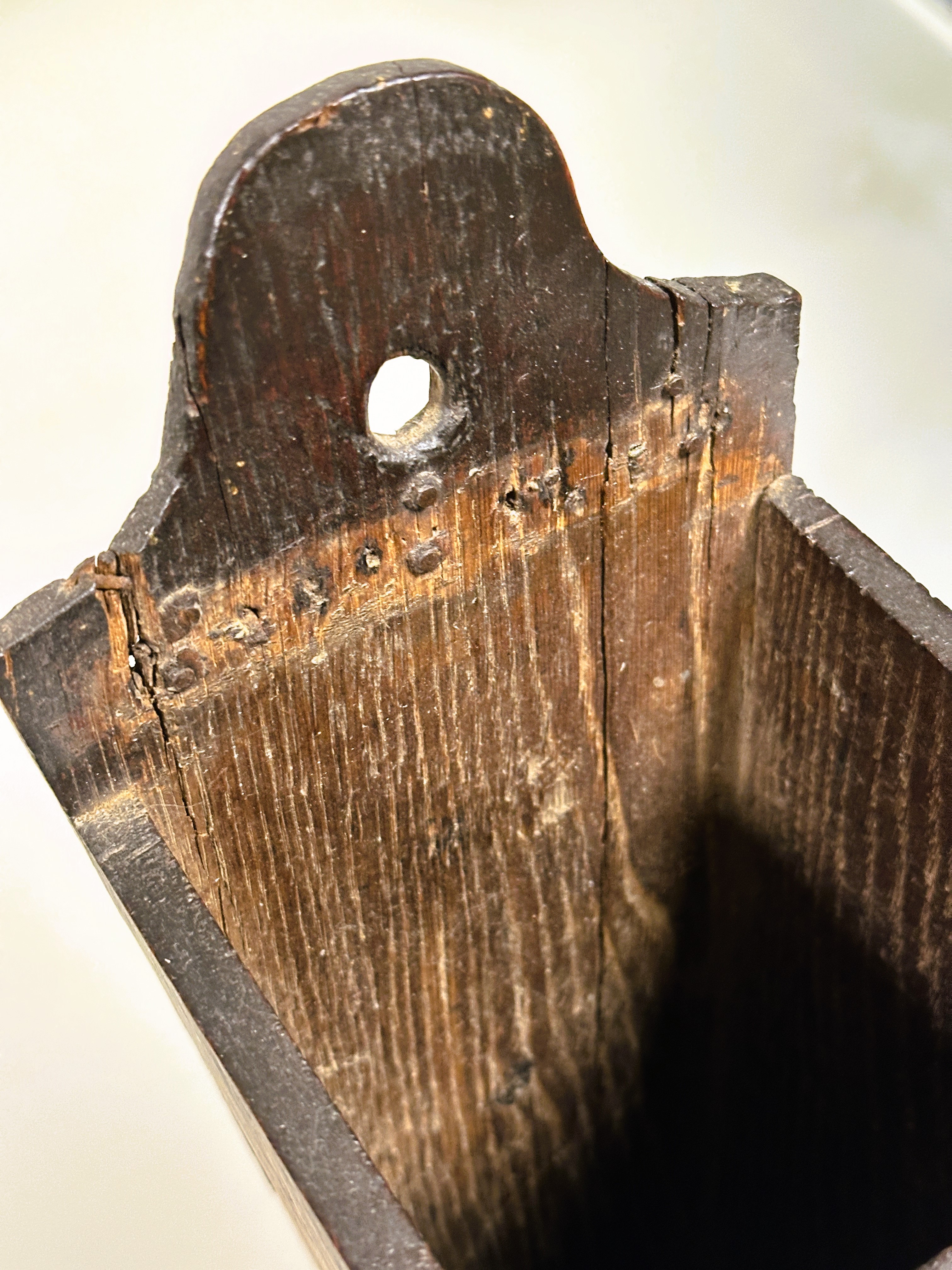 A 18thc oak candle box of tapered form with arched panel back with pierced hole and replaced base - Image 5 of 5