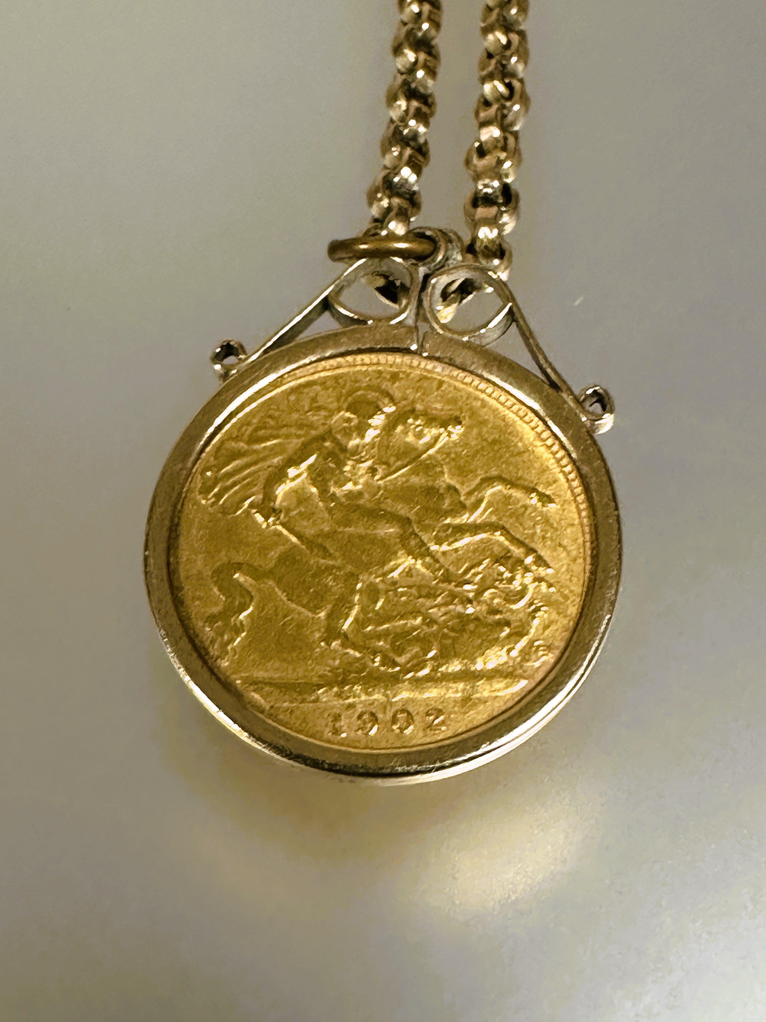 A Edward VII gold half sovereign 1902 in yellow metal frame on a 9ct gold belcher link chain - Image 3 of 3
