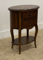 A French style walnut bedside chest of oval outline, the cross banded top centred with eight point