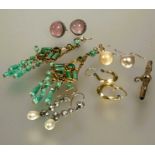 A collection of earrings to include a pair of green gilt metal chandelier style earrings set green