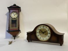 A walnut cased dome top mantel clock by Hermle, with cream dial and Roman chapter ring, the eight