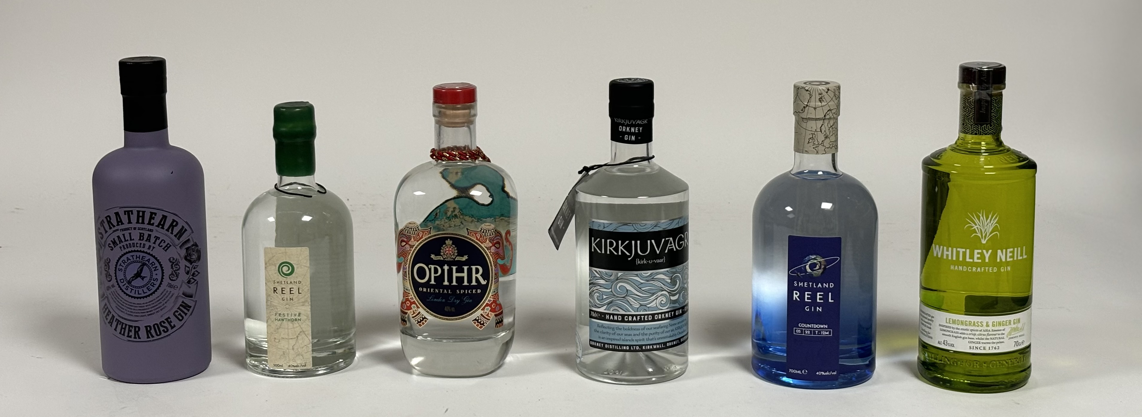 A collection of six bottles of various gin comprising, Kirkjuvagr Orkney Gin (43% vol), Shetland