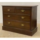 A Edwardian walnut chest the top with moulded edge fitted two short and two long drawers raised on