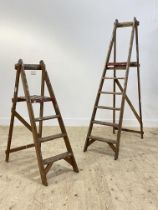 A graduated pair of vintage decorators folding step ladders. larger H186cm.