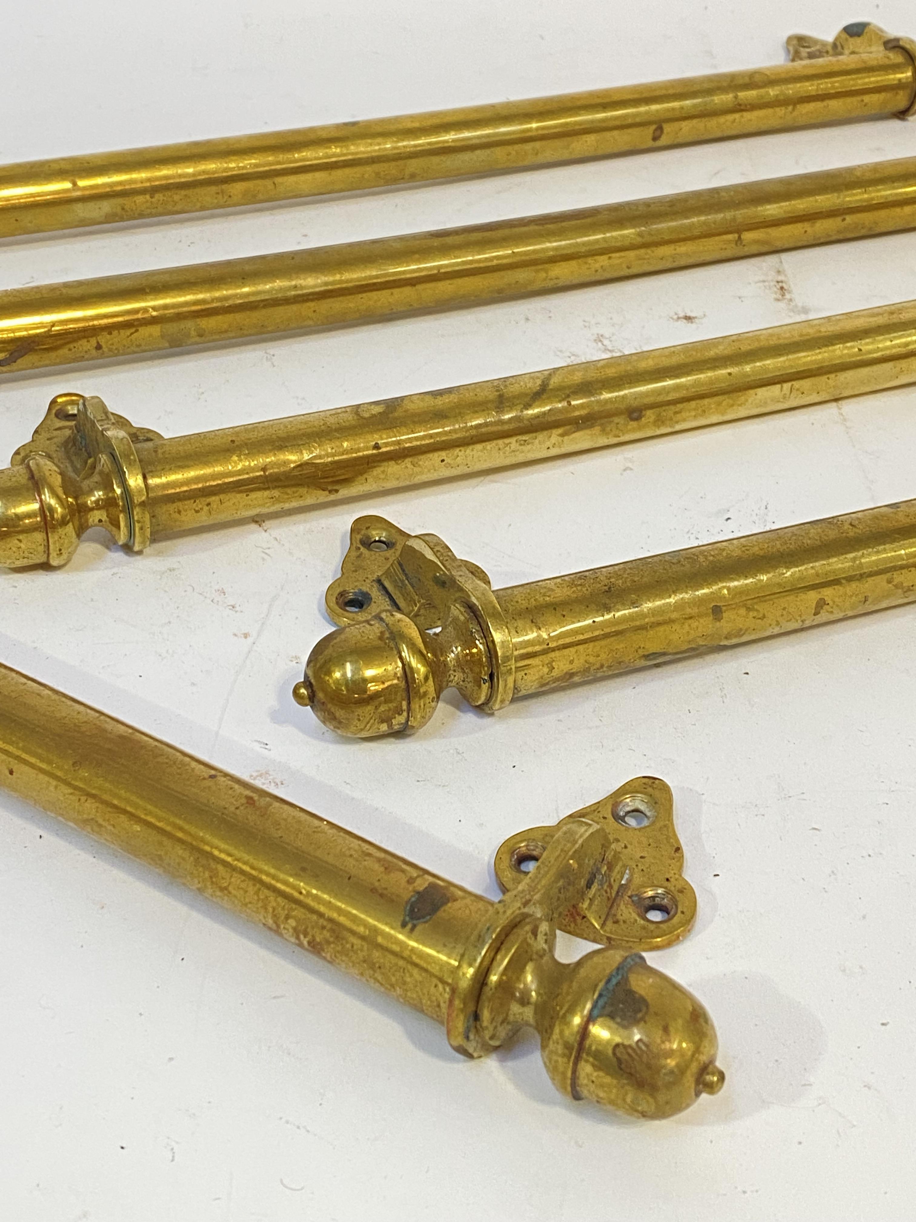 A set of five late 19th century brass sash window handles. L55cm. - Image 2 of 2