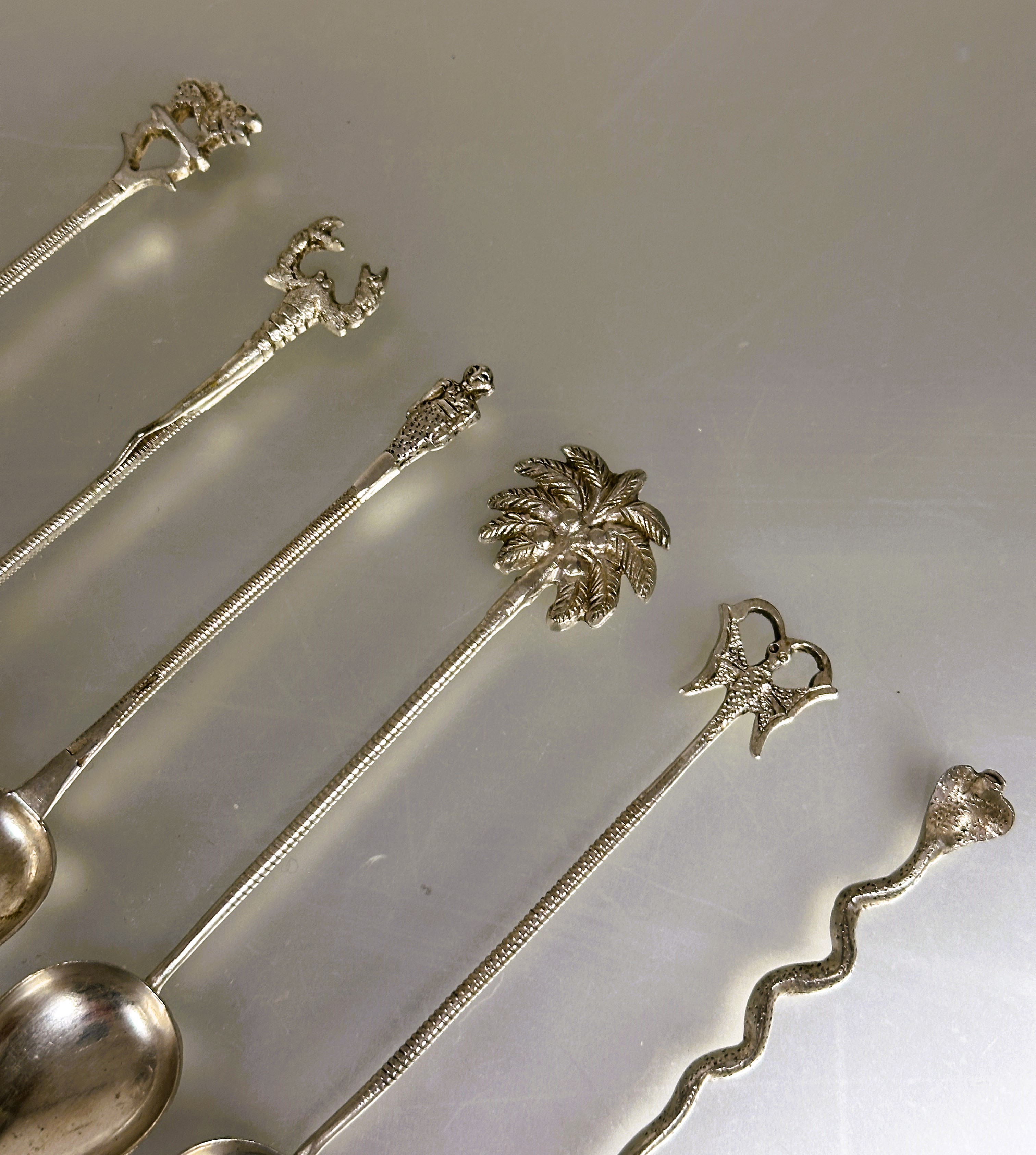 A set of six eastern white metal tea spoons each with different terminal including a palm tree, - Image 2 of 2