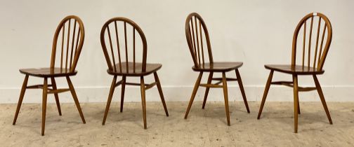 Ercol, a set of four mid century elm and beech dining chairs, circa 1970's, with hoop and spindle