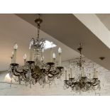 A pair of Victorian style gilt brass eight branch chandeliers, each with pressed glass lustres and