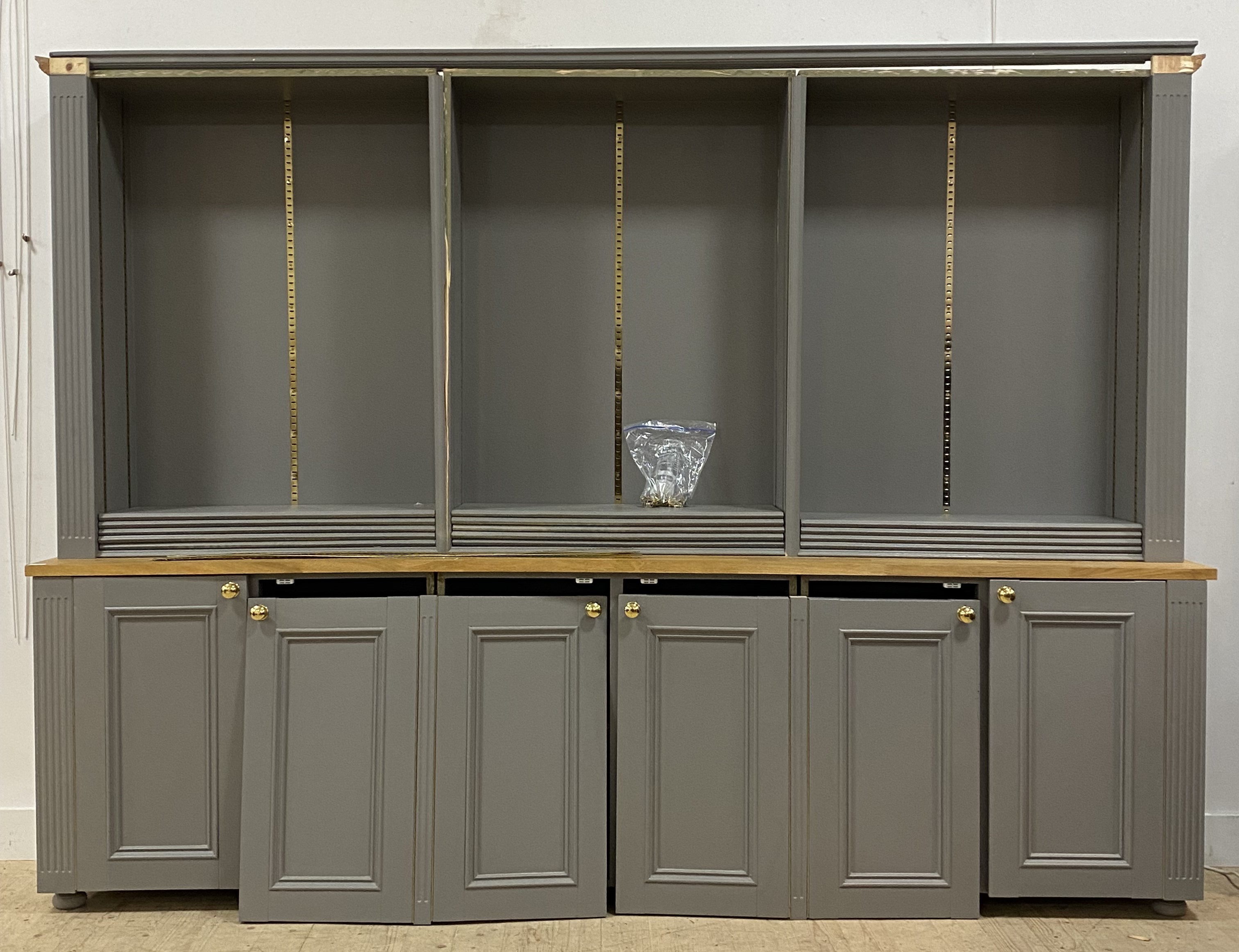 A Bespoke grey painted pine, beech and MDF bookcase cabinet, fourteen adjustable shelves, above