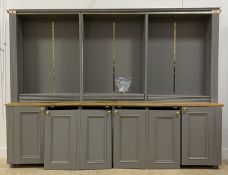 A Bespoke grey painted pine, beech and MDF bookcase cabinet, fourteen adjustable shelves, above