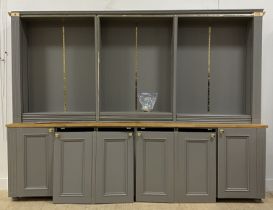 A Bespoke grey painted pine, beech and MDF bookcase cabinet, fourteen adjustable shelves, above