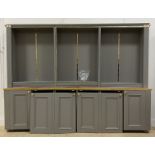 A Bespoke grey painted pine, beech and MDF bookcase cabinet, fourteen adjustable shelves, above