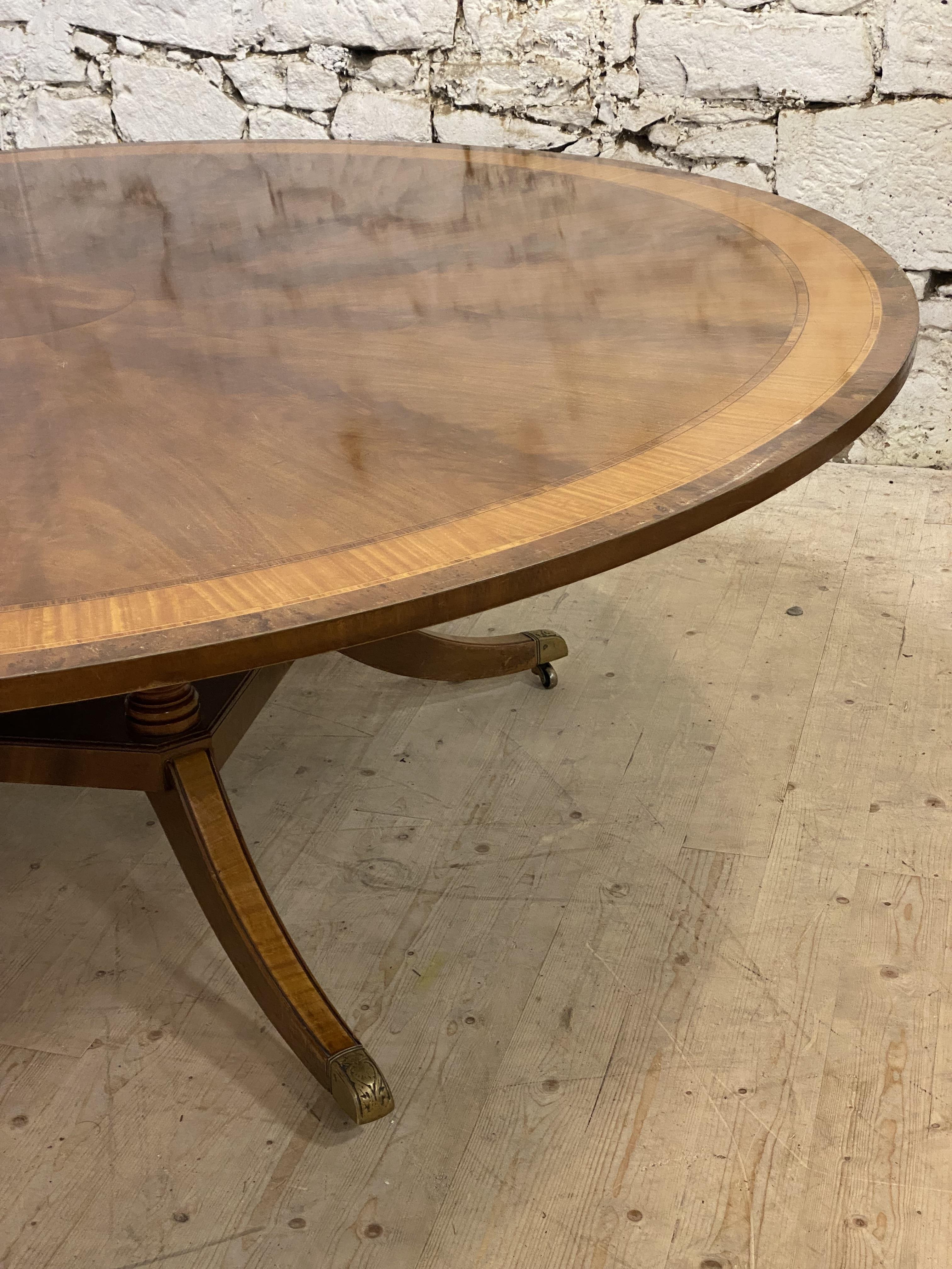 Restall Brown & Clennell, a large Regency style mahogany dining table, the circular top with cross - Image 3 of 4