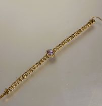 A late 19thc 9ct gold engraved kerb link chain bracelet with clasp fastening and safety chain