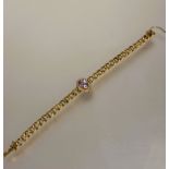 A late 19thc 9ct gold engraved kerb link chain bracelet with clasp fastening and safety chain