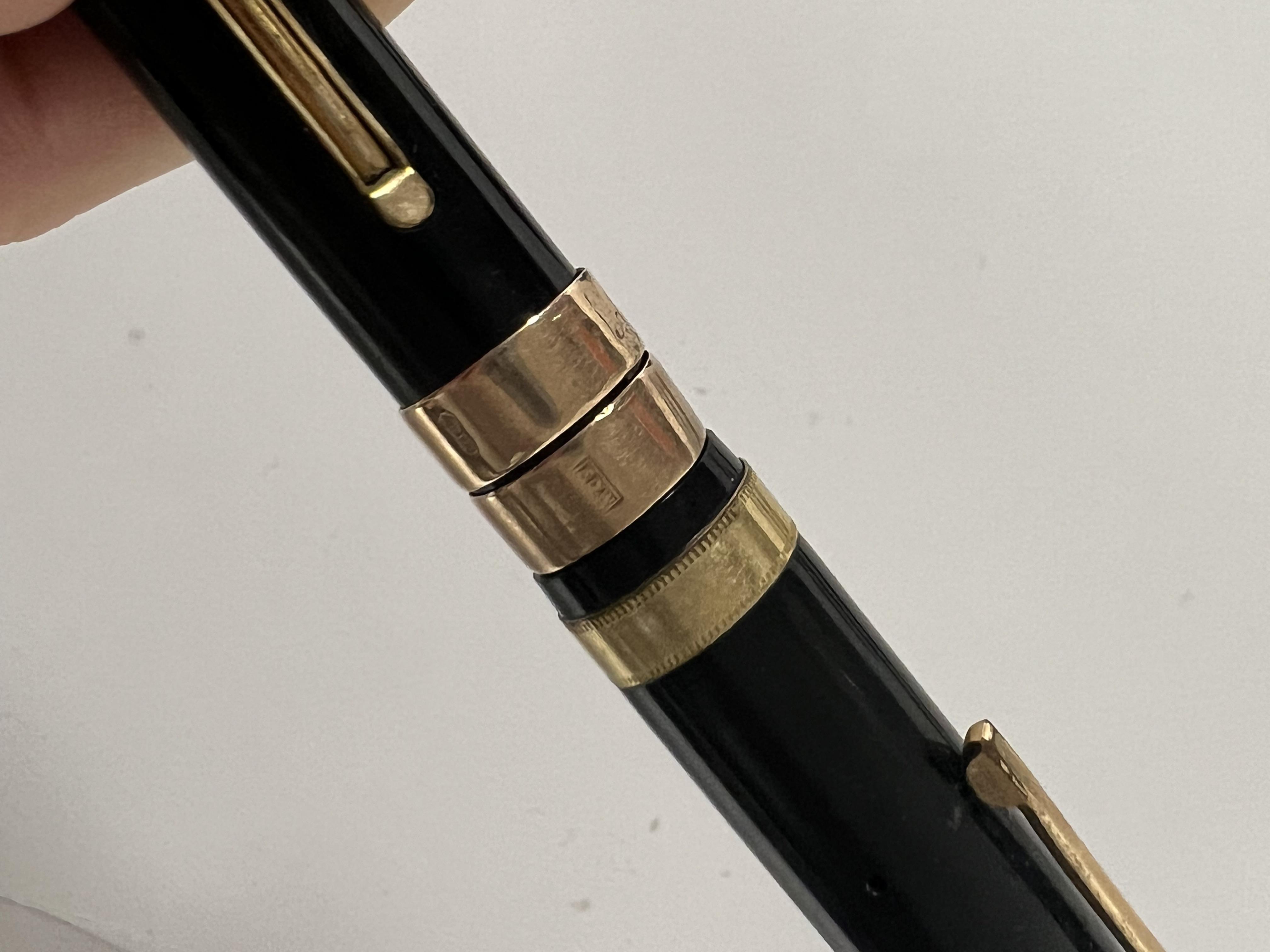 A group of five vintage pens comprising a faux tortoiseshell Parker pen, a Parker 51, a Swan auto- - Image 4 of 4