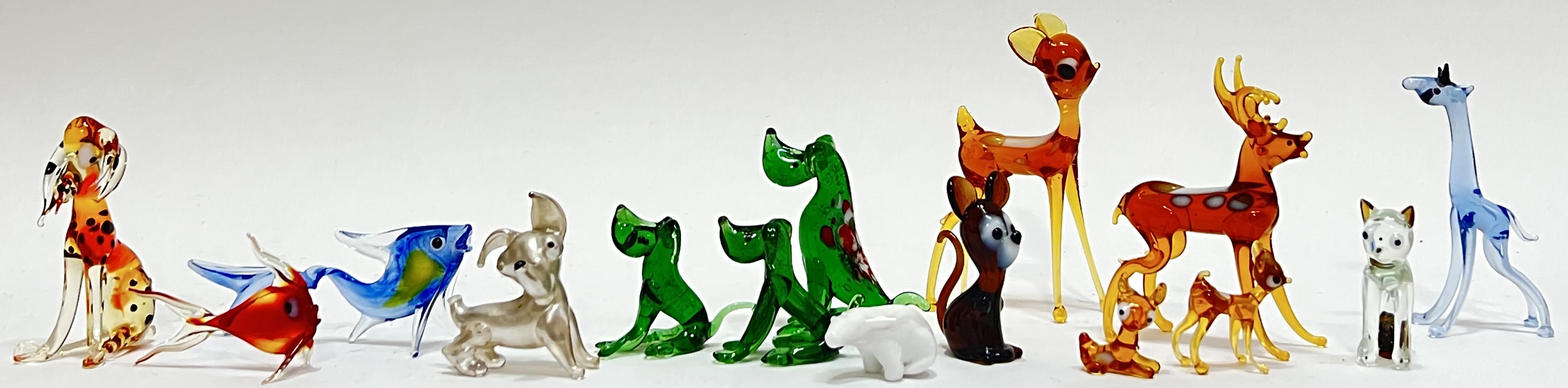 A mixed group of lampwork glass animals including fish, deer, dogs, giraffe, cat, Polar Bear