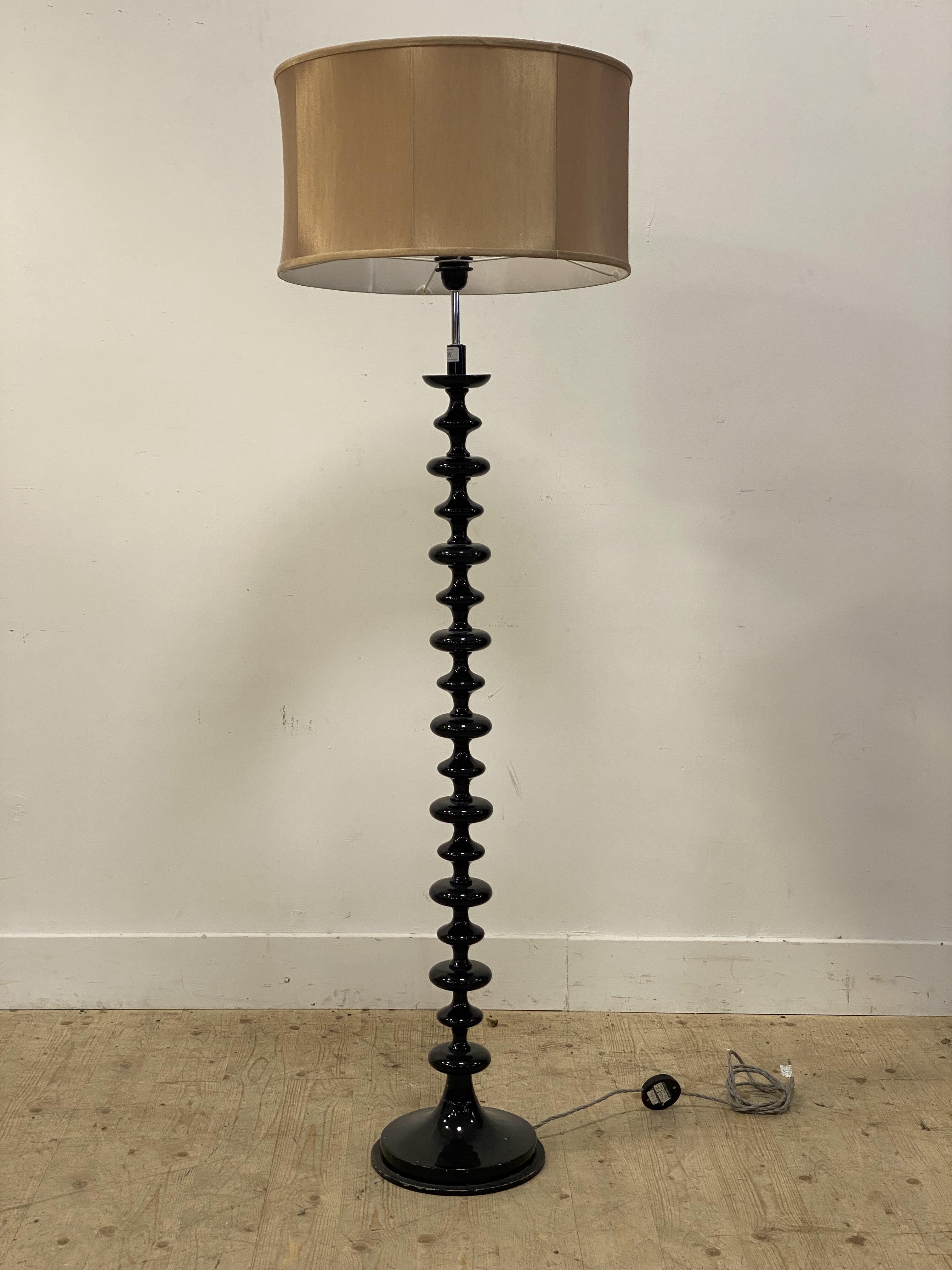 A contemporary lamp standard, the column, of bobbin form, raised on a circular base, complete with