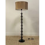 A contemporary lamp standard, the column, of bobbin form, raised on a circular base, complete with