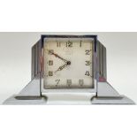 An Art Deco chrome plated clock with 8 Day movement, retailed by Brook and Son of Edinburgh, the