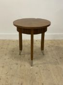 A contemporary oak lamp table, the circular top above a reeded frieze, raised on square tapered