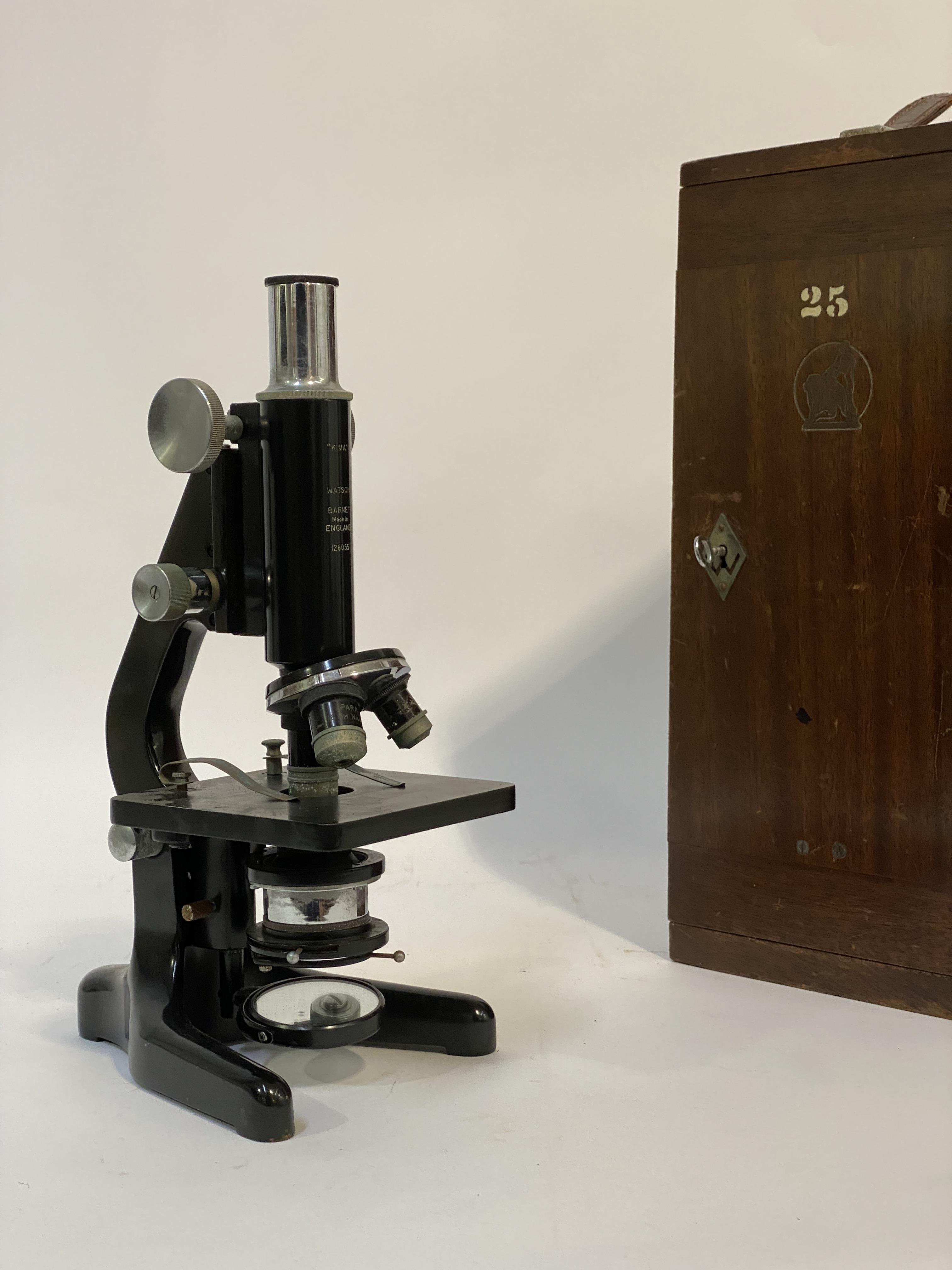 An early to mid 20th century "Kima" monocular microscope by W Watson & Sons, London, in a mahogany
