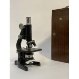 An early to mid 20th century "Kima" monocular microscope by W Watson & Sons, London, in a mahogany