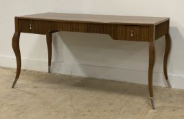 A contemporary oak knee hole desk, the rectangular top above a reeded frieze fitted wit two drawers,
