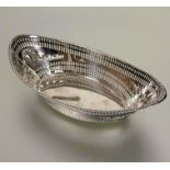 A late Victorian Sheffield silver navette shaped nut dish with beaded pierced border and chased