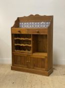 A late 20th century pine kitchen cabinet, the raised back inset with tiles and two drawers, above