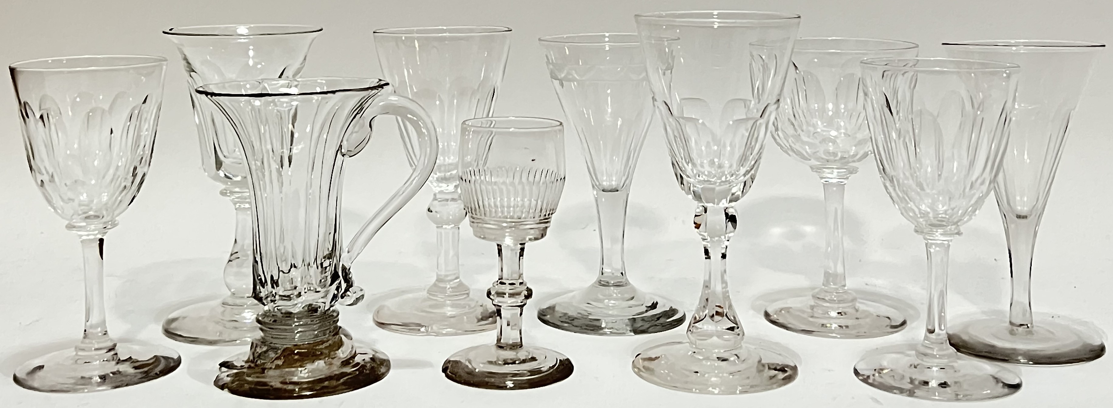 A collection of antique drinking glasses of various forms, mainly nineteenth century (mostly a/f,