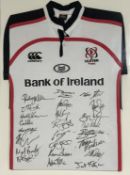 A framed Ulster Rugby Ireland shirt, with players signatures in black ink. (80cmx59cm)