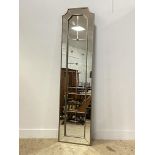 A large contemporary silvered wood and composition sectional wall hanging mirror. 207cm x 52cm.