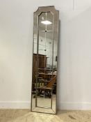 A large contemporary silvered wood and composition sectional wall hanging mirror. 207cm x 52cm.