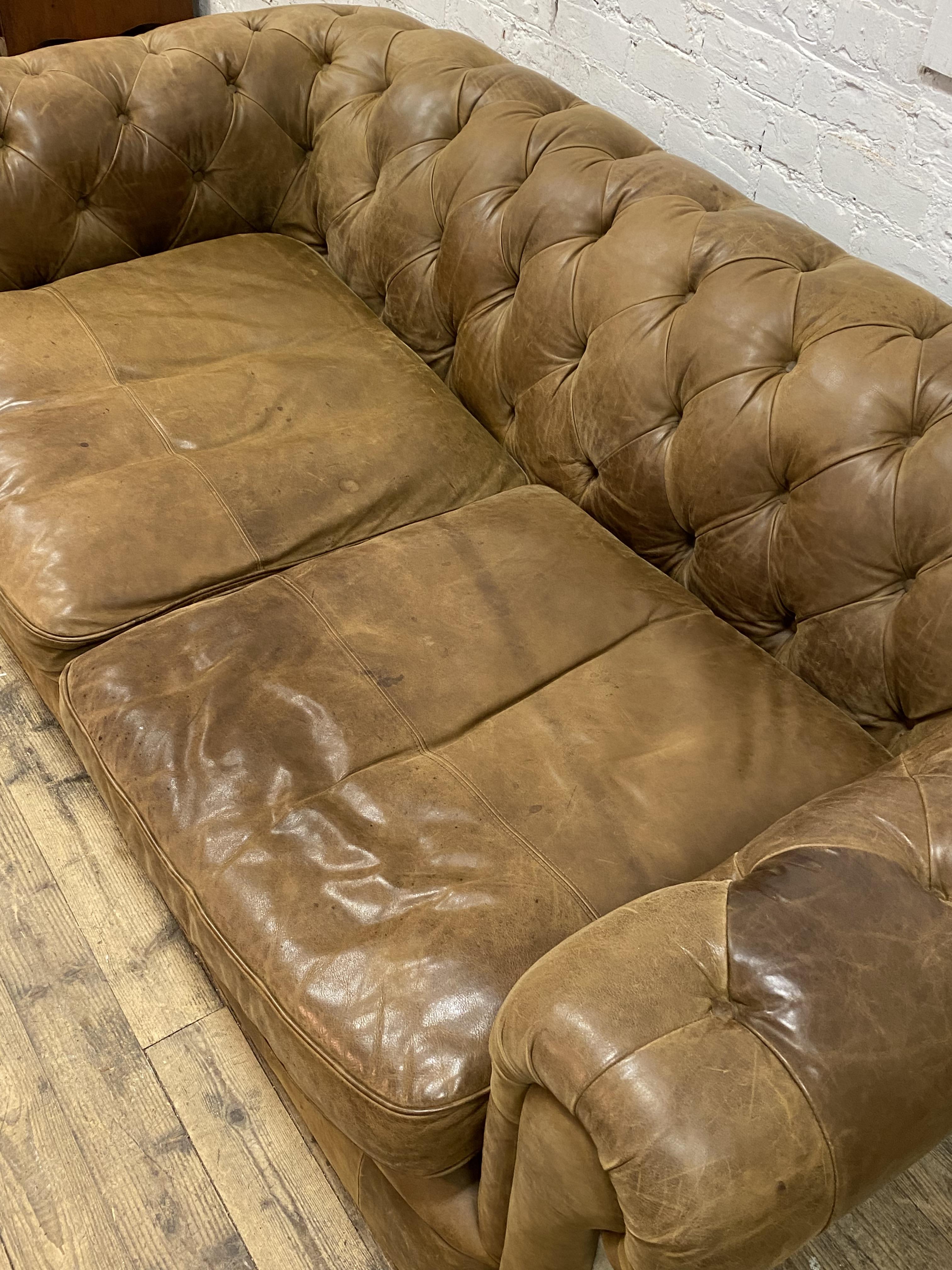 A traditional chesterfield sofa, upholstered in deep buttoned tan leather and crushed velvet sides - Image 3 of 3