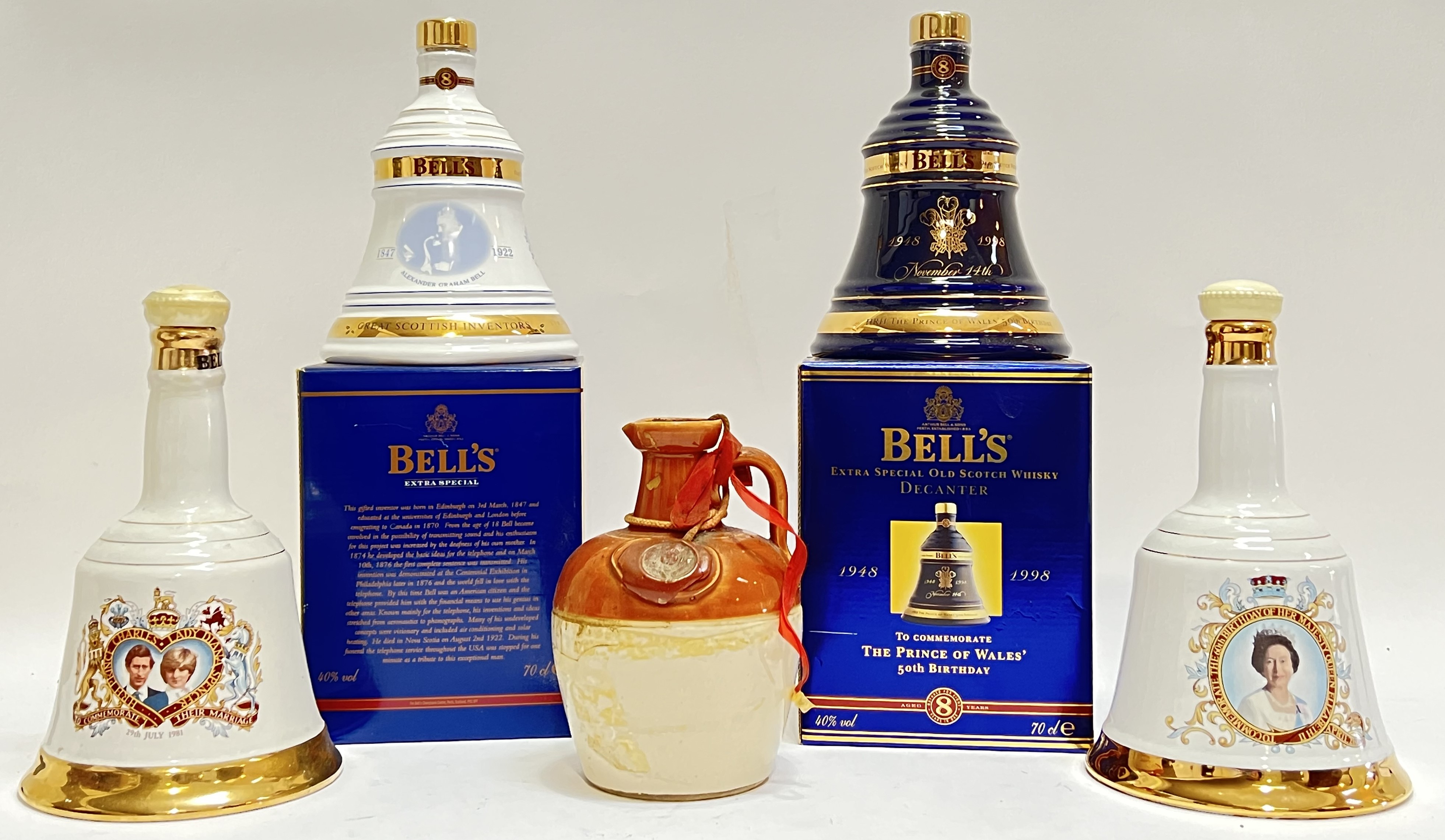 Four bottles of Bell's commemorative whisky comprising a 1981 Charles and Diana 75cl bottle, a