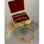 A box containing a collection of costume jewellery to include silver curb link bracelet with heart