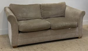 A contemporary fawn plush two seat sofa, with squab cushions and raised on block supports. H80cm,