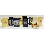 Eight whisky water jugs comprising Famous Grouse, Grant's, Bell's etc...(largest h- 18cm, w- 18cm)