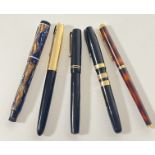 A group of five vintage pens comprising a faux tortoiseshell Parker pen, a Parker 51, a Swan auto-