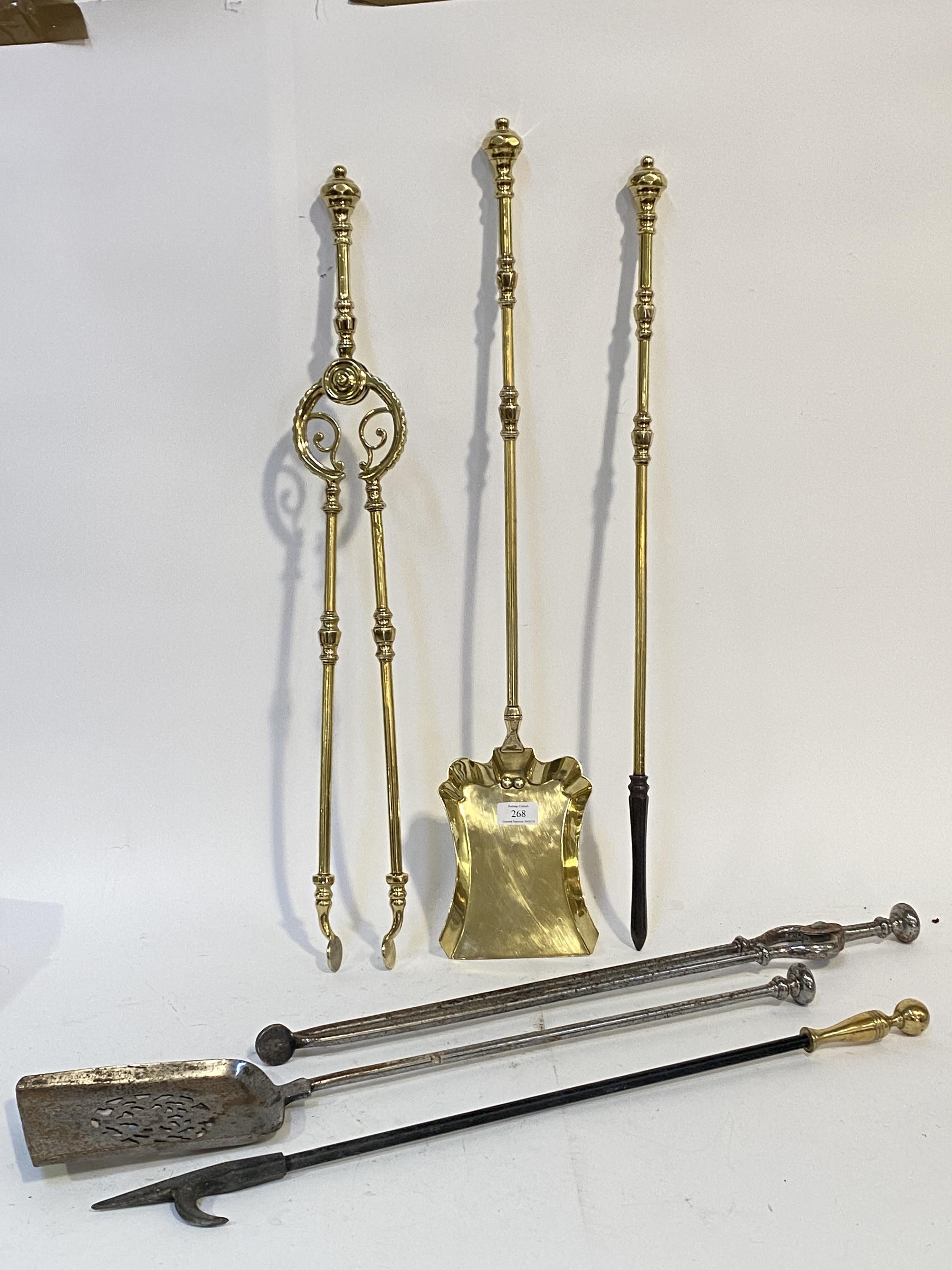 A late Victorian three piece cast brass fireside companion set, comprising a poker, pair of tongs, - Image 2 of 2