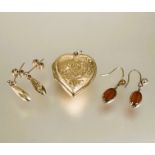 A 9ct gold engraved heart shaped locket H x 2.5cm and a pair of 9ct gold teardrop style earrings L x