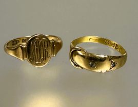 A 18ct gold buckle style ring set two clear stones L / M 1.4g and a 9ct gold oval signet ring with